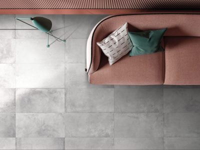 Top view of sofa and coffee table on concrete floor. 3D Rendering